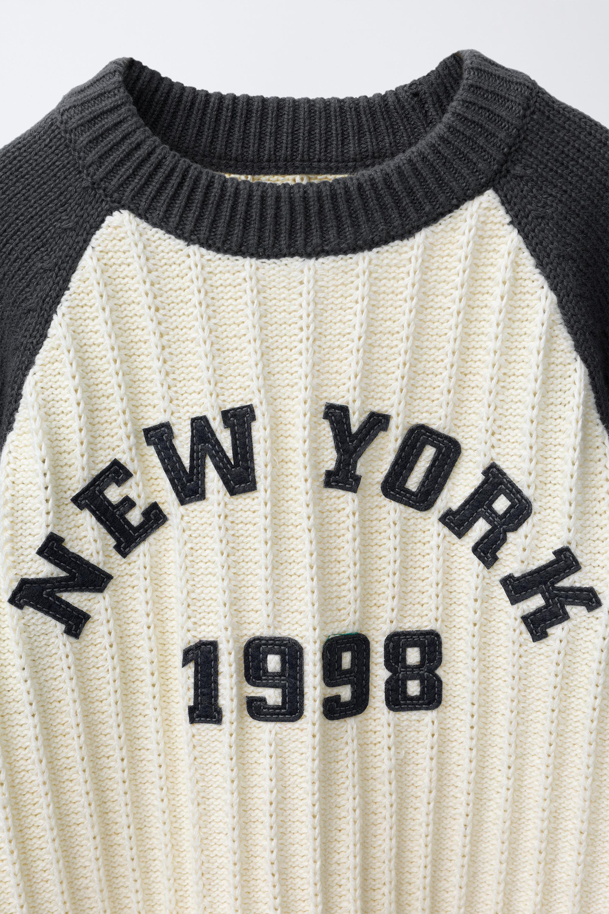TEXTURED KNIT TEXT JUMPER